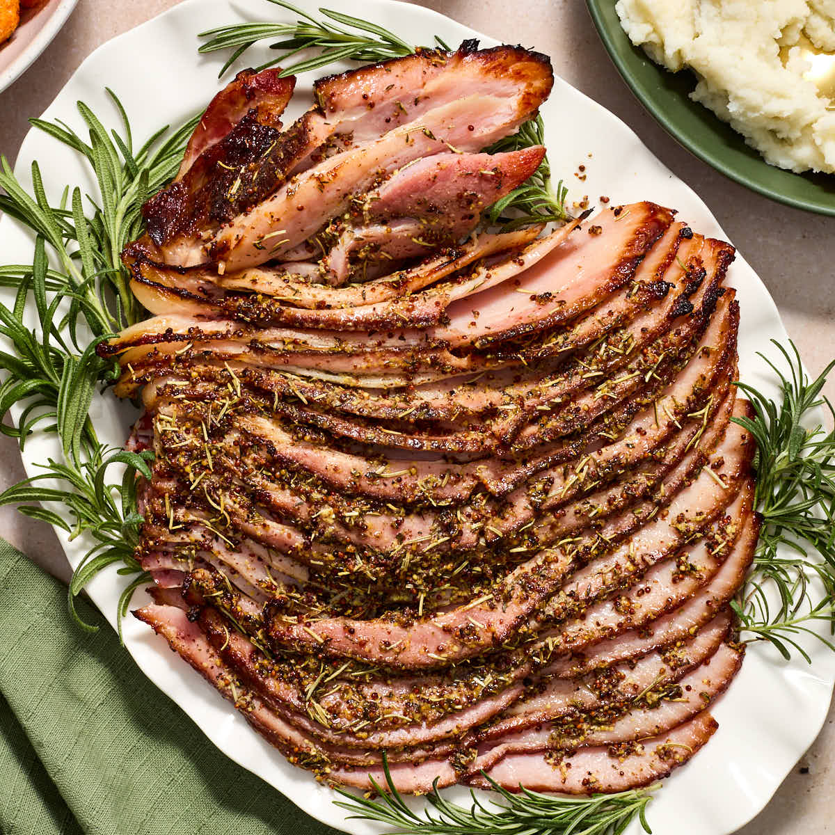 Ham sliced on a platter.