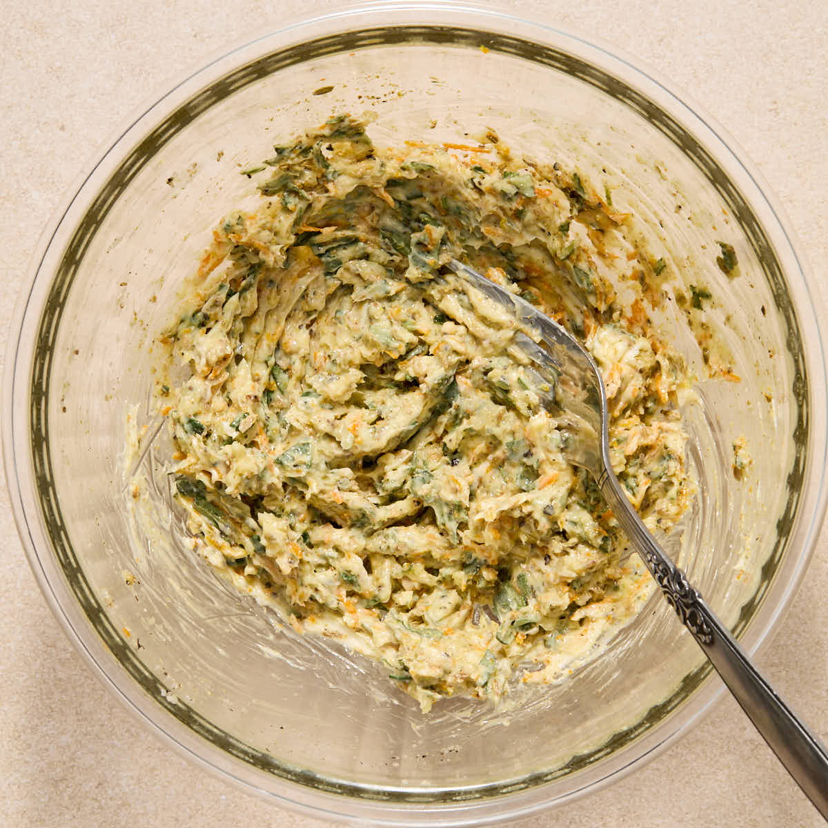 Butter rub mixture mixed together with a fork in a small glass bowl.