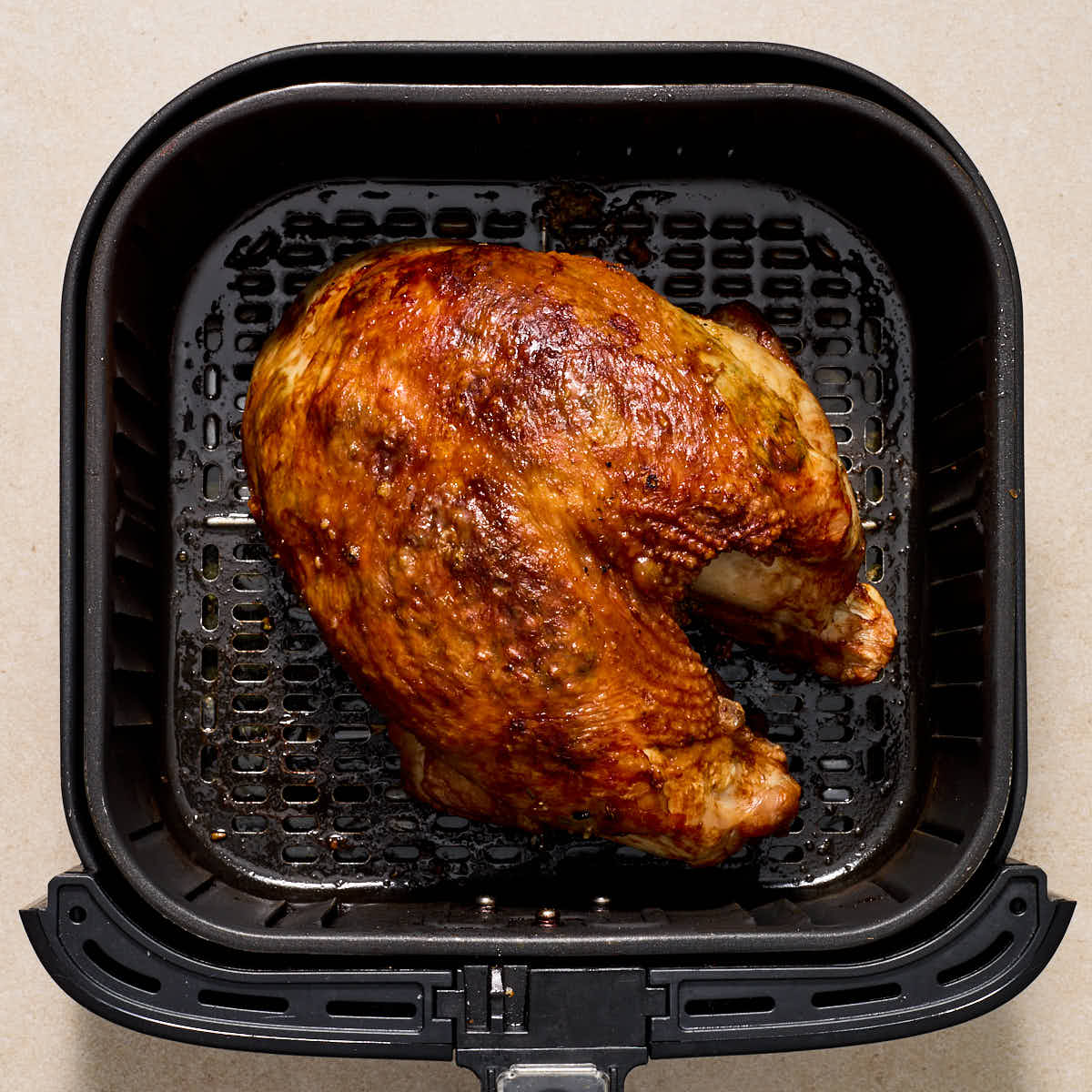 Finished turkey breast in the air fryer basket.
